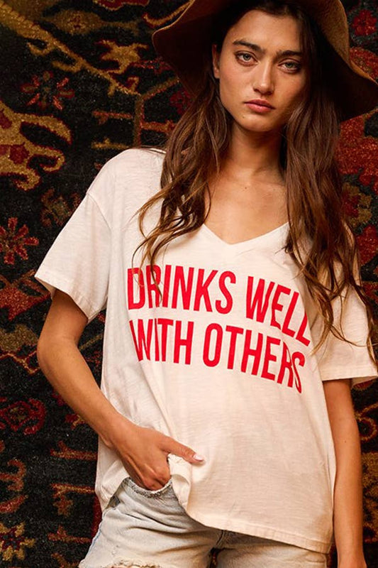 DRINKS WELL WITH OTHERS Graphic T-shirt